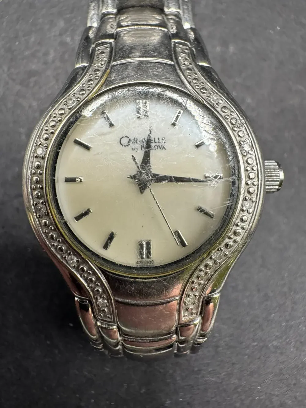 Vtg Caravelle by Bulova Silver Tone White Dial Diamond Accent Women’s Watch 24mm